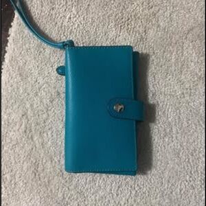 New with out tags. Teal color cellphone wallet wristlet